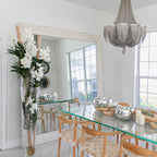 White Vanda Orchids and Driftwood Inside a Large Conical Glass Cylinder